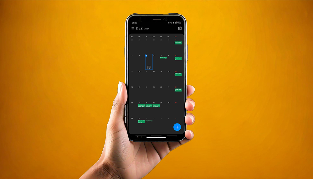 Hand hält ein Smartphone. Auf dem Smartphone ist die Kalender-App zu sehen.